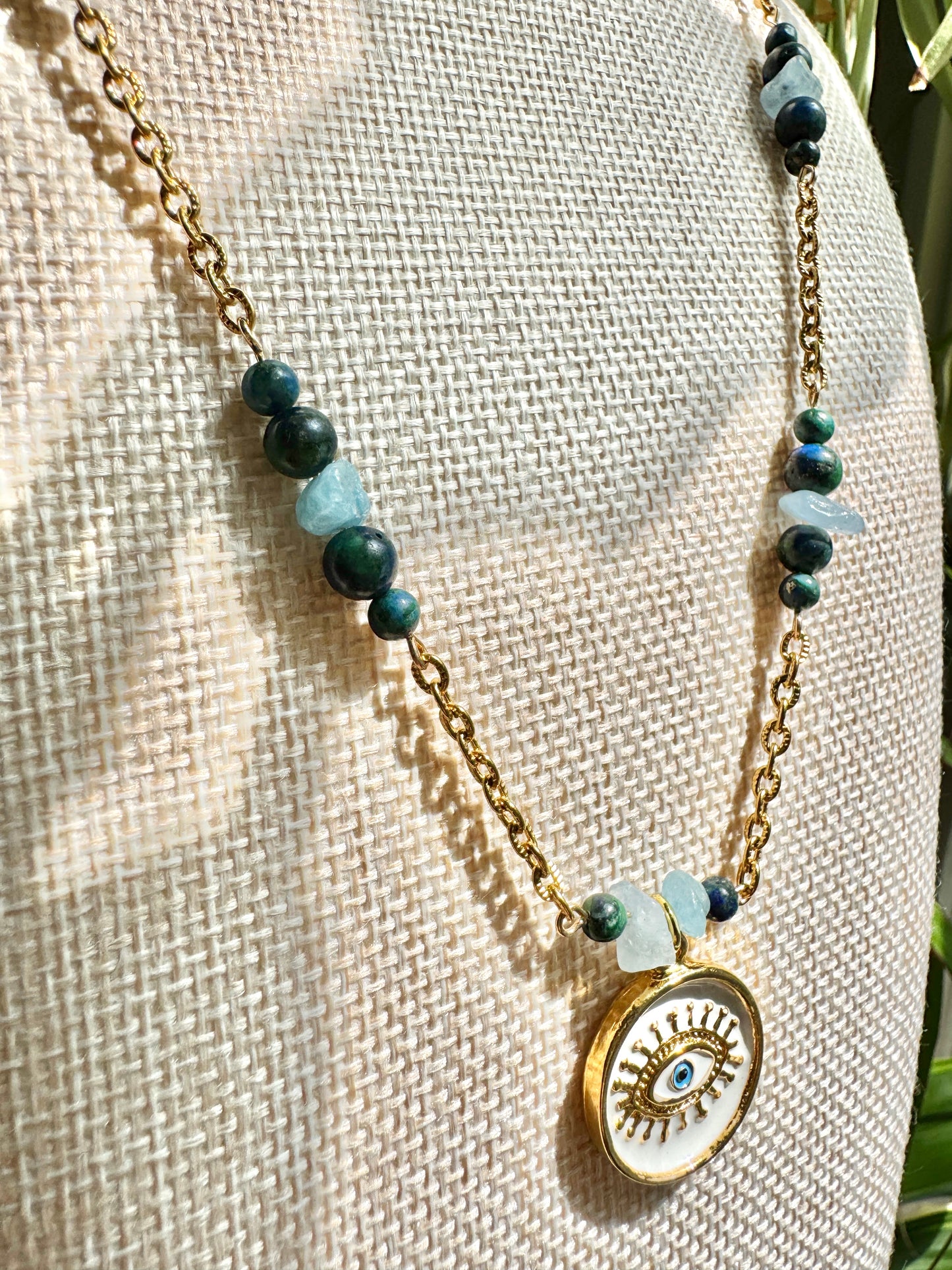 Eye pendant necklace close up on mannequin bust