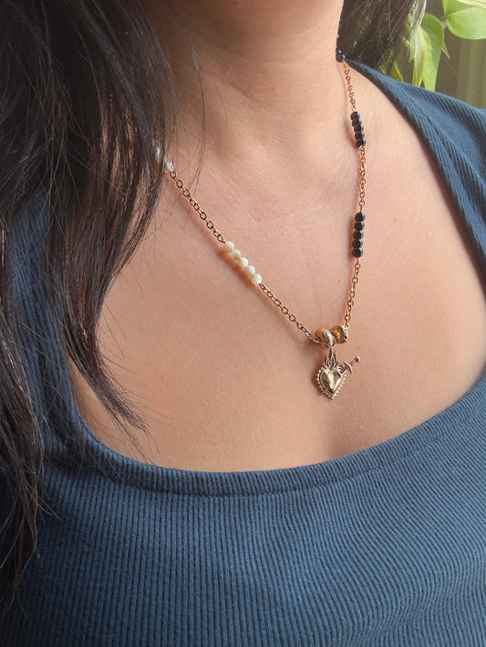 Heart necklace on model, side view