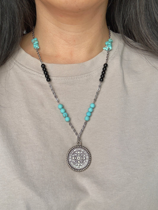 St. Benedict medallion necklace on model