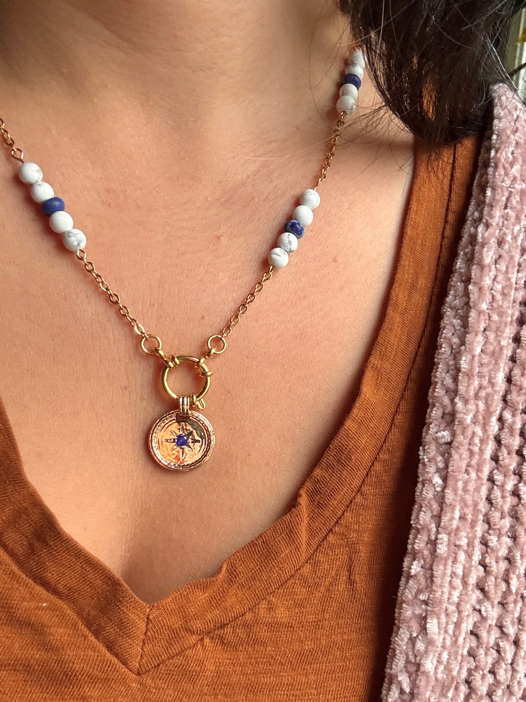 Close up of blue stone necklace on model