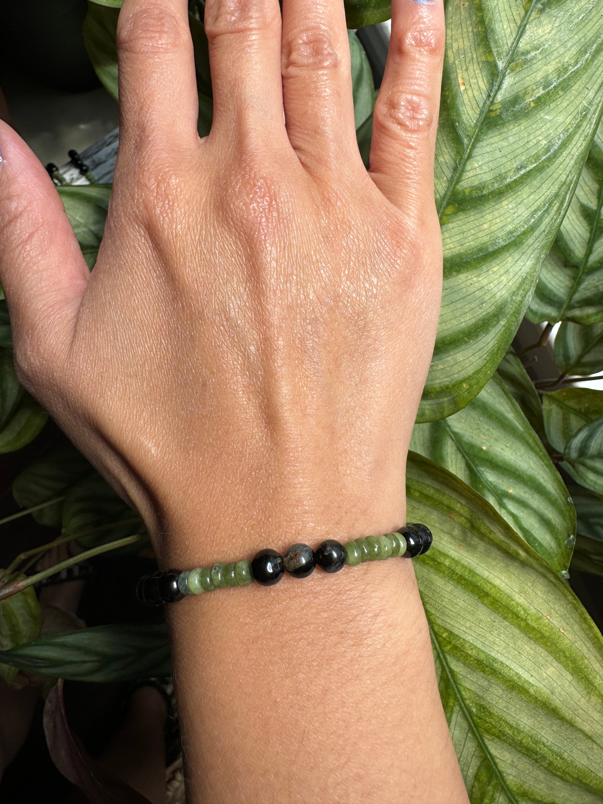 black tourmaline and olive jade beaded bracelet wrist view