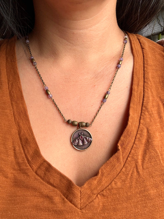 Antique gold color metal pendant with moth on antique color chain with amethyst and brass beads
