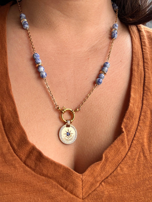 Blue stone in gold plated pendant on stainless steel gold plated chain with sodalite beads