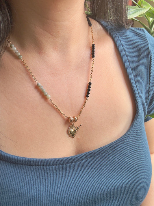 Heart necklace on model, side view