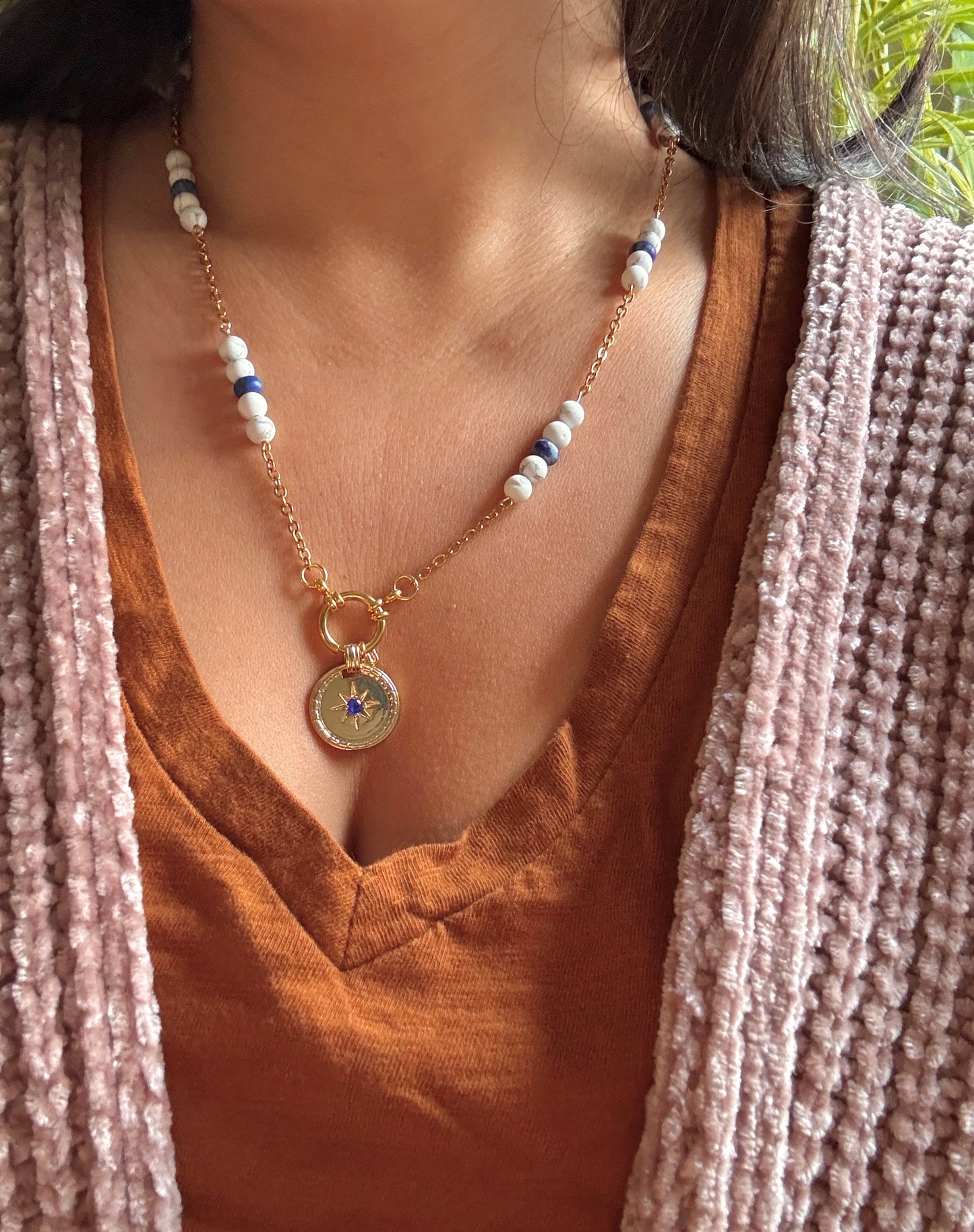 Blue stone pendant necklace on model