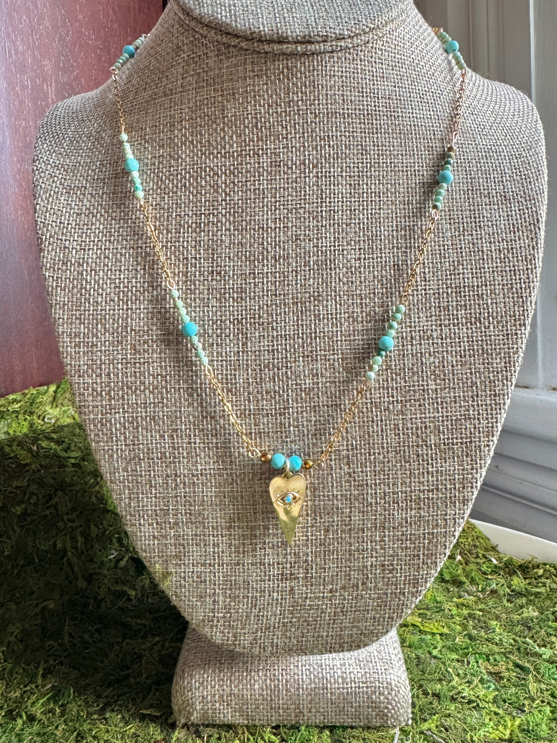 Necklace with turquoise beads on a mannequin bust