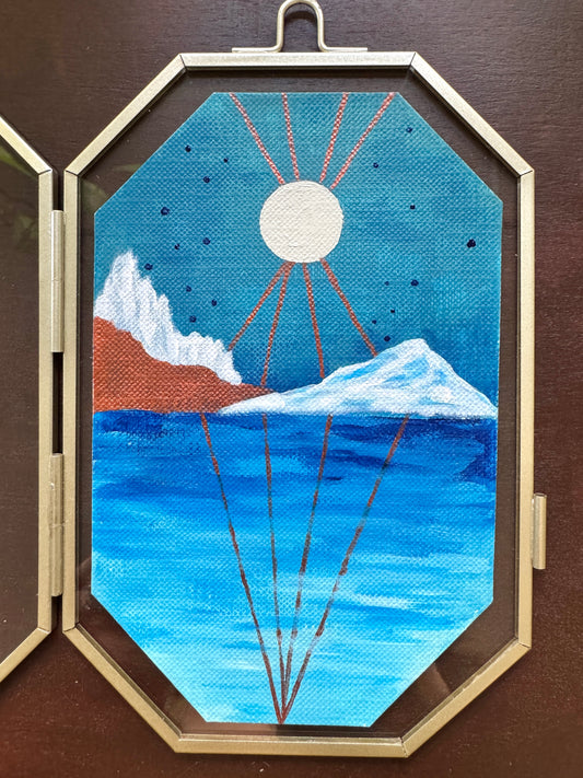 Geometric Landscape painting on glass frame against a wood background