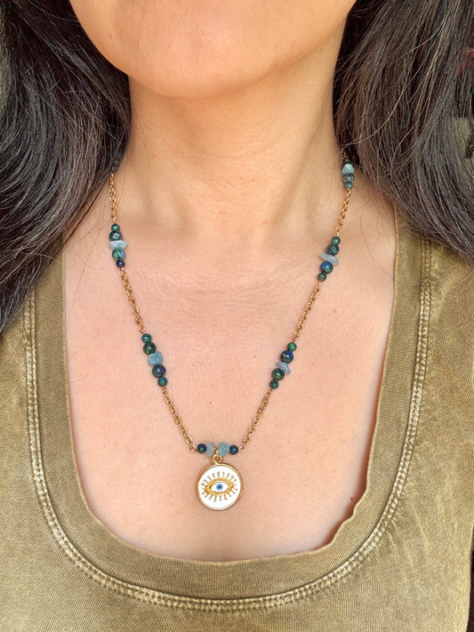 Eye pendant necklace worn by model