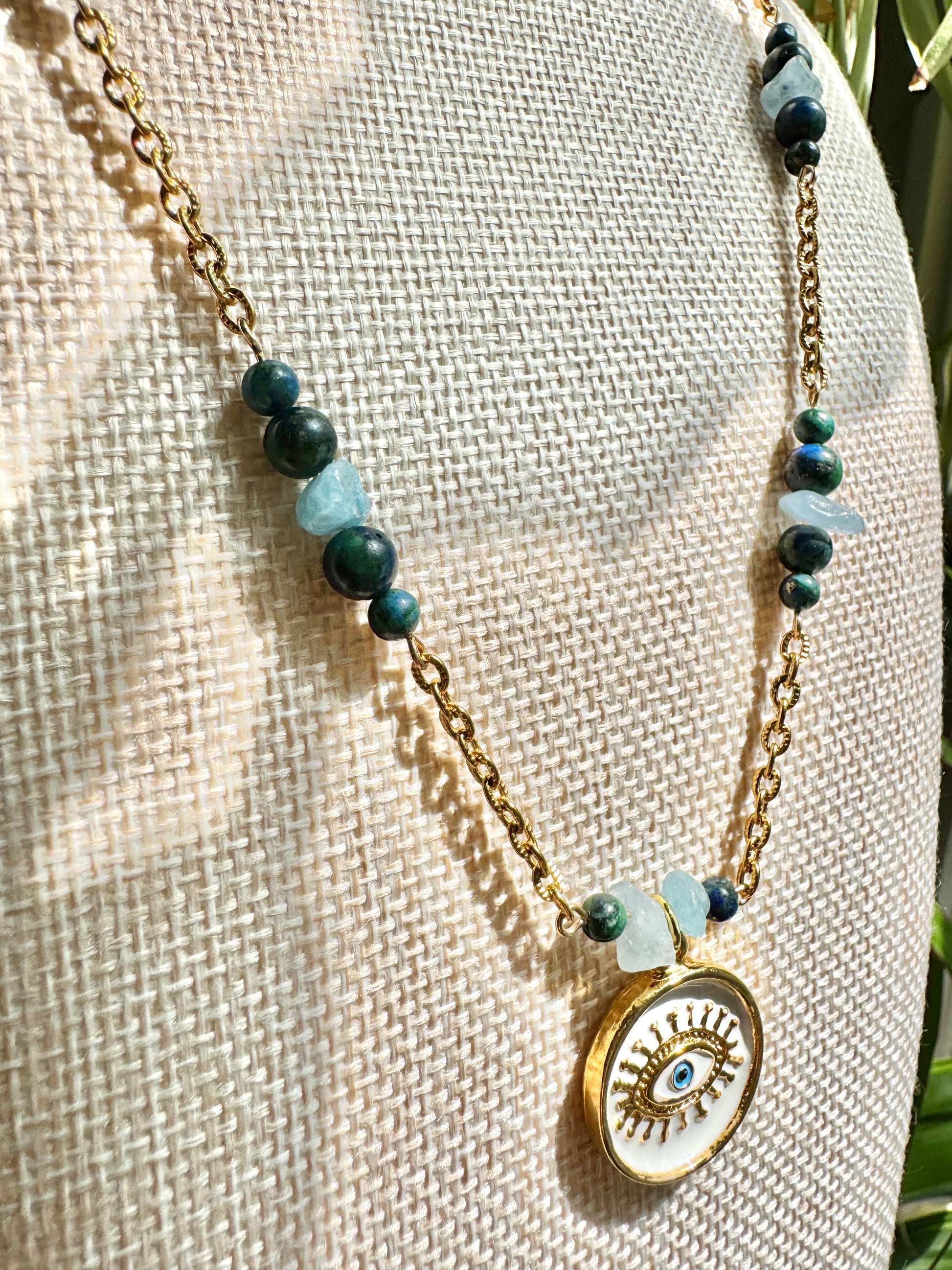Eye pendant necklace close up on mannequin bust
